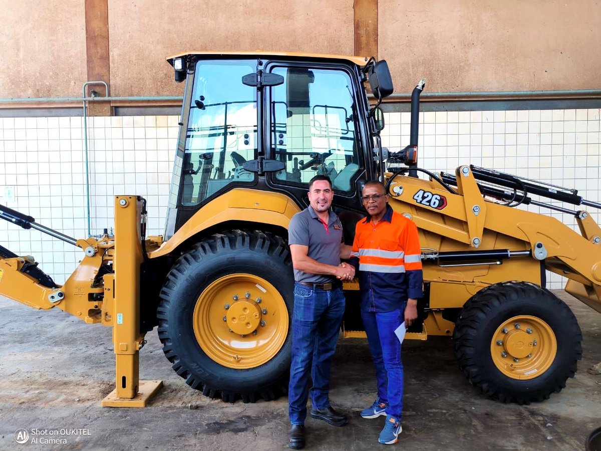 NAS leadership accepting delivery of a new TLB / backhoe loader